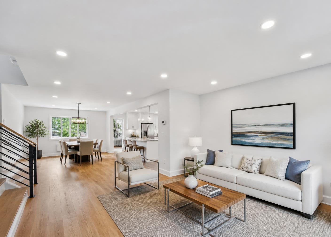Completed bright room with a smooth modern ceiling and recessed lighting